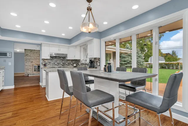 a view of a dining room with furniture window and outside view