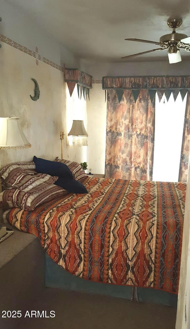 2860 North Elliott Road Ajo, AZ 85321 - Photo 20 of 35 a bedroom with a bed and a window