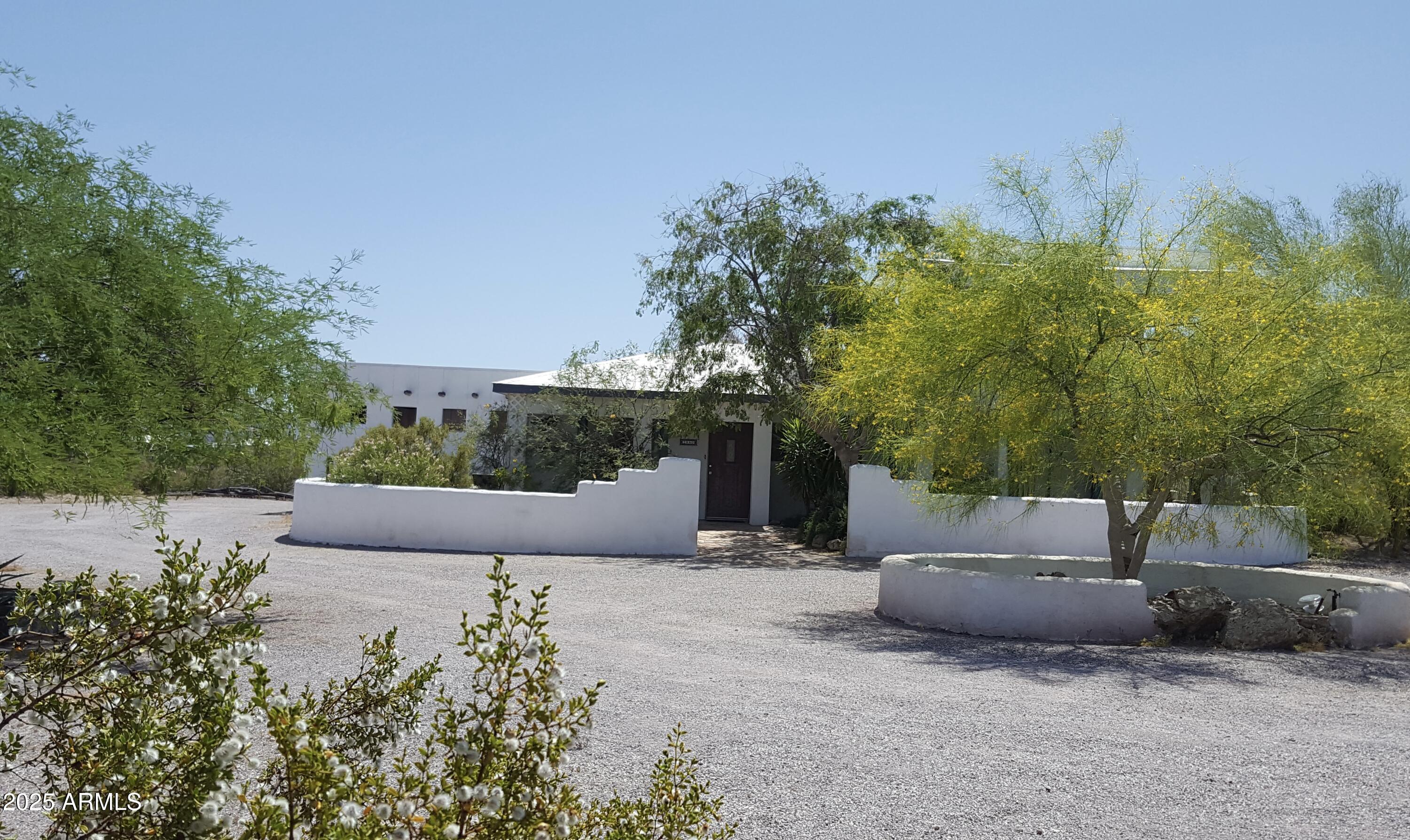2860 North Elliott Road Ajo, AZ 85321 - Photo 5 of 35 a view of a garden with an outdoor seating