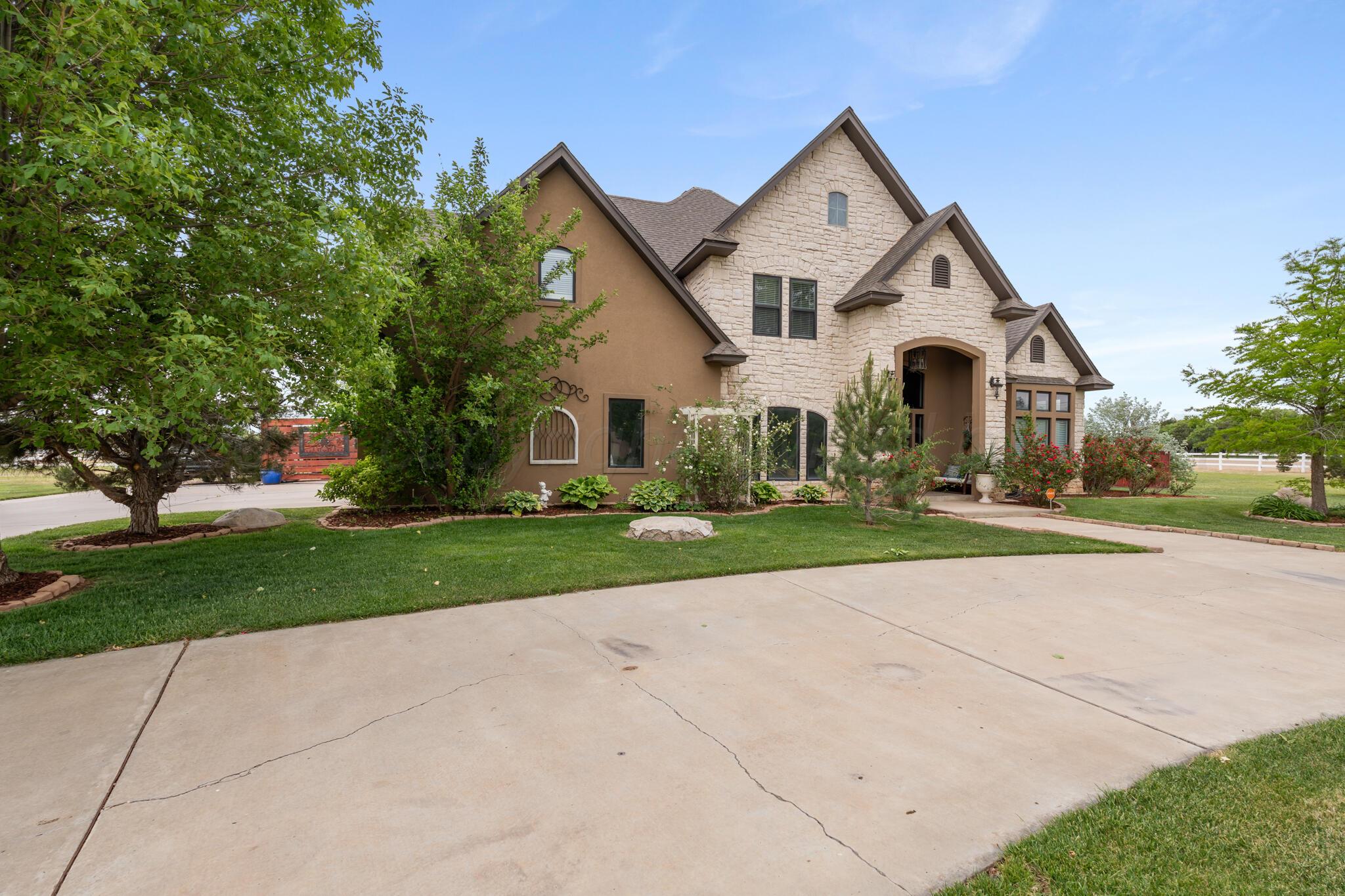 8901 Red Wing Road Amarillo, TX 79119 - Photo 2 of 66 a front view of a house with a yard