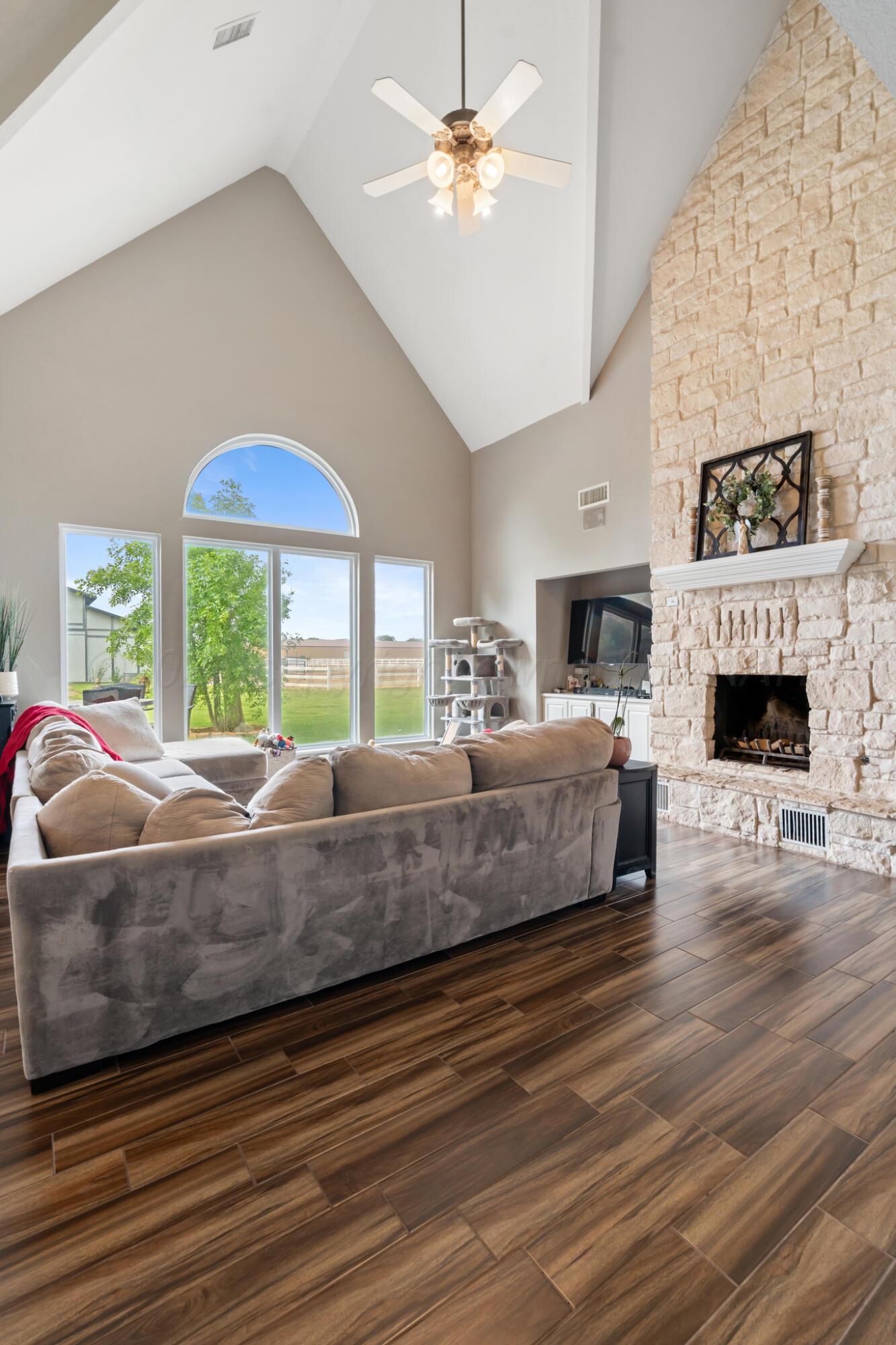 8901 Red Wing Road Amarillo, TX 79119 - Photo 21 of 66 a living room with furniture and a fireplace