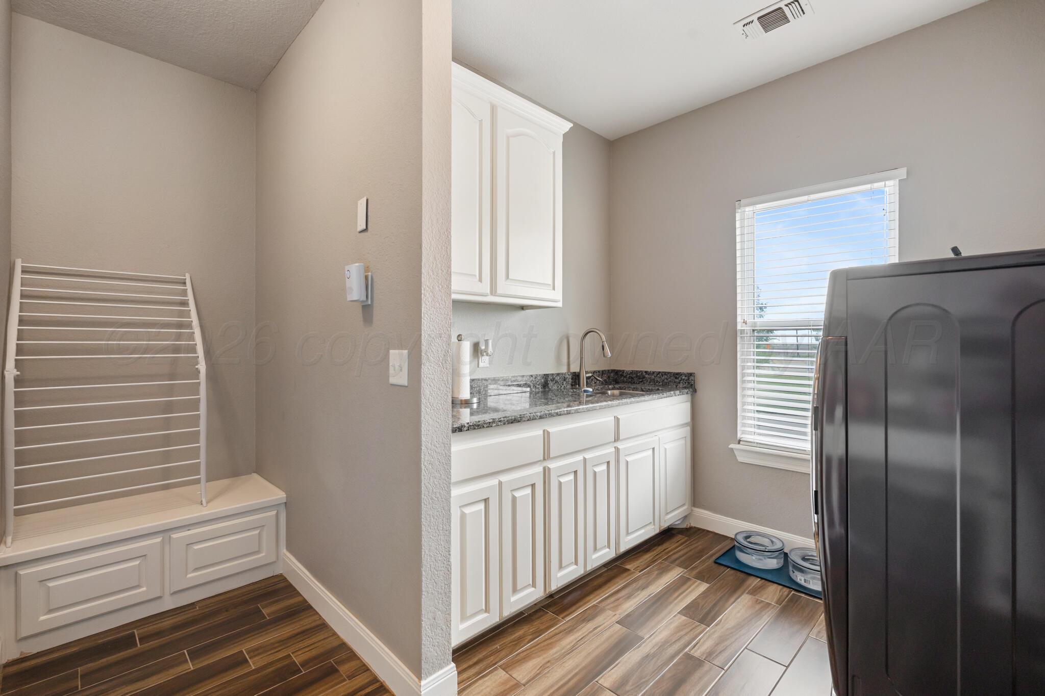 8901 Red Wing Road Amarillo, TX 79119 - Photo 25 of 66 a kitchen with stainless steel appliances granite countertop a refrigerator and a sink
