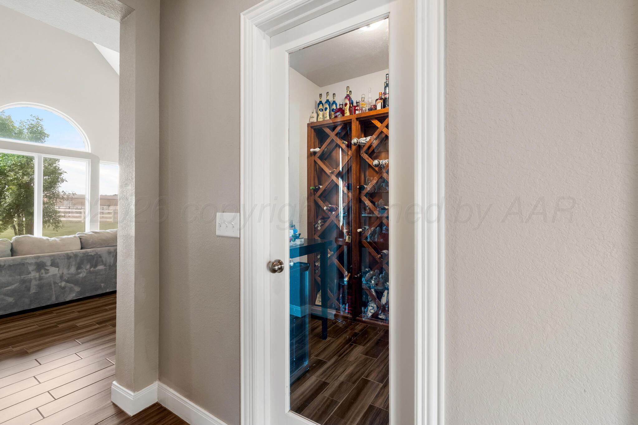 8901 Red Wing Road Amarillo, TX 79119 - Photo 28 of 66 a view of walk in closet with clothes and shoes