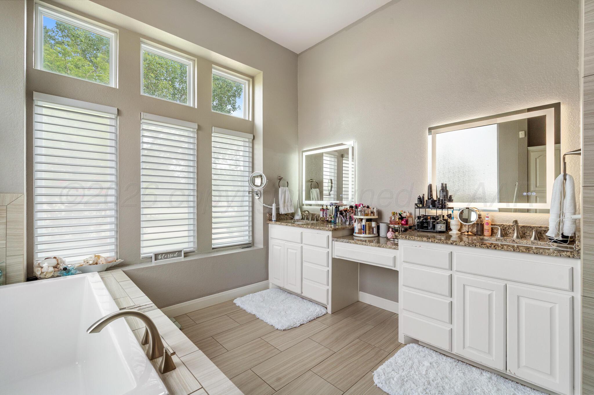8901 Red Wing Road Amarillo, TX 79119 - Photo 51 of 66 a room with two sinks and a large window