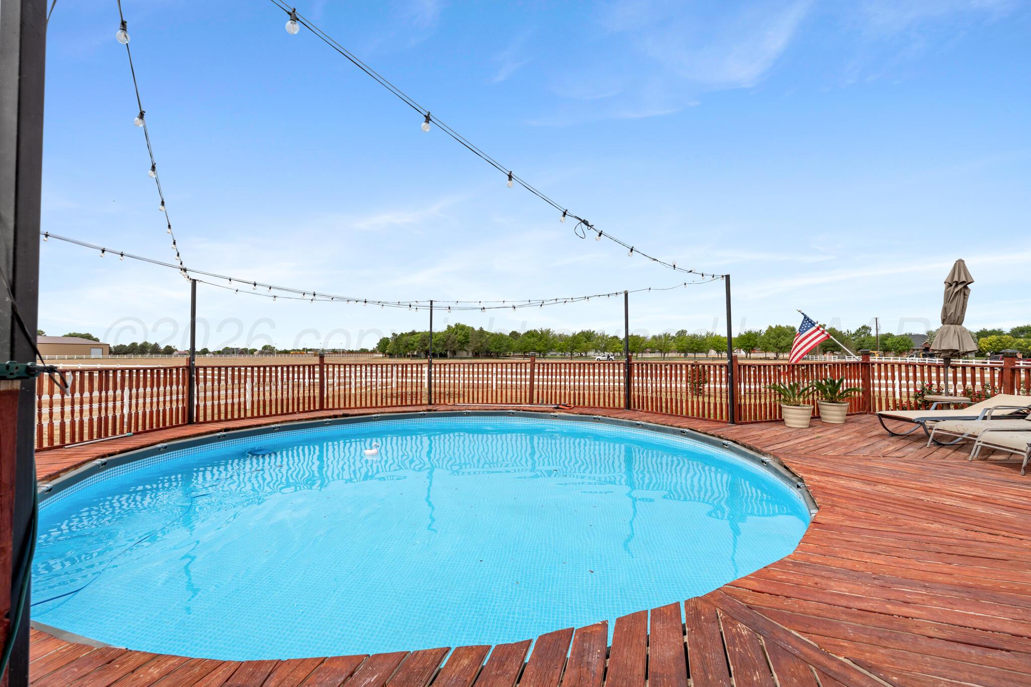 8901 Red Wing Road Amarillo, TX 79119 - Photo 52 of 66 a view of a swimming pool with outdoor seating