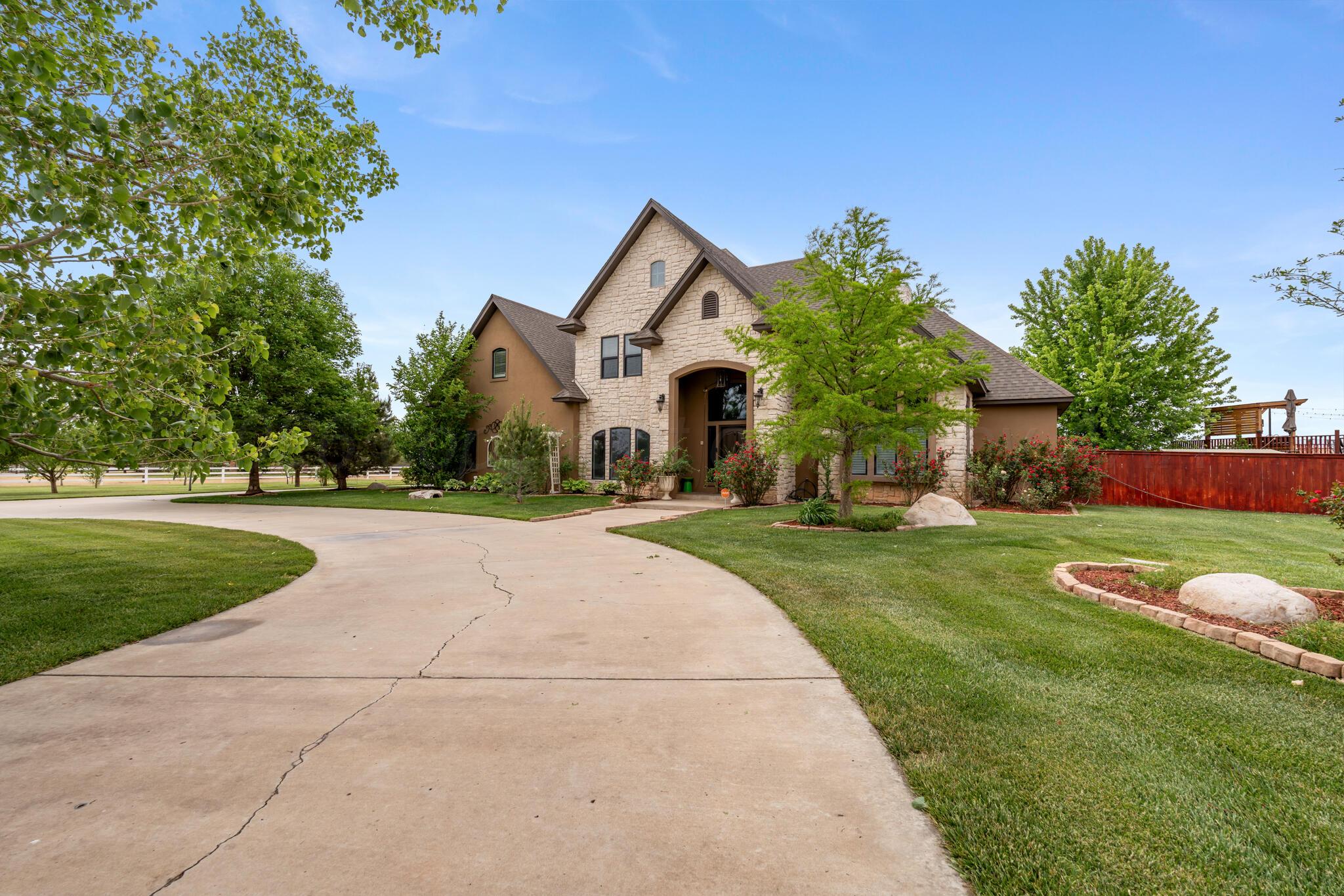 8901 Red Wing Road Amarillo, TX 79119 - Photo 6 of 66 a front view of house with yard and green space