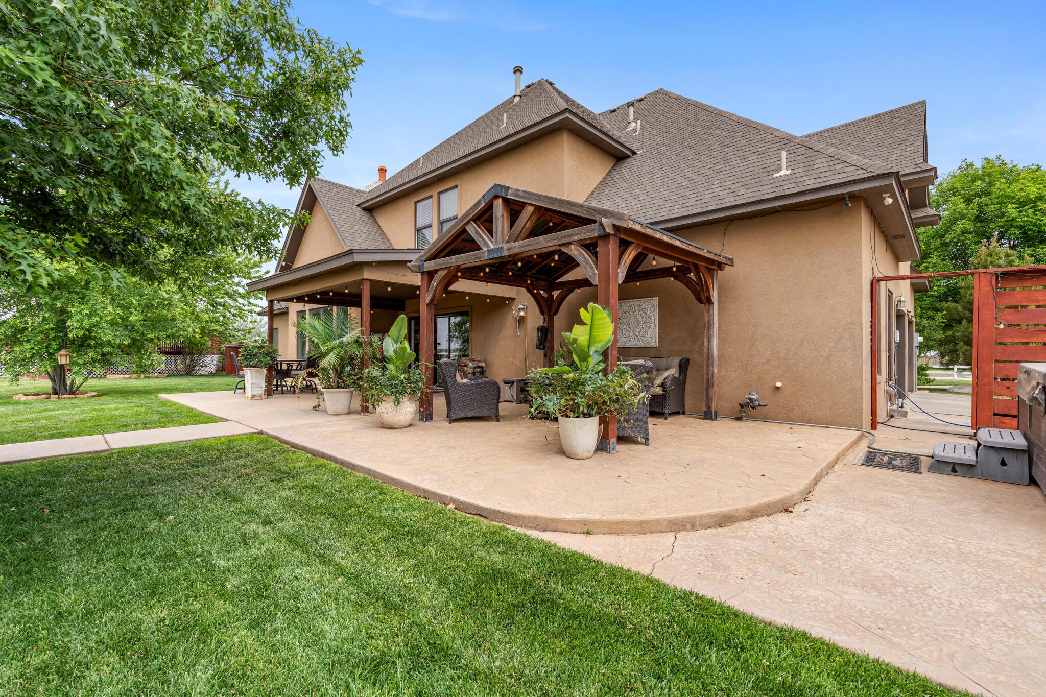 8901 Red Wing Road Amarillo, TX 79119 - Photo 63 of 66 a view of an house with backyard and sitting area