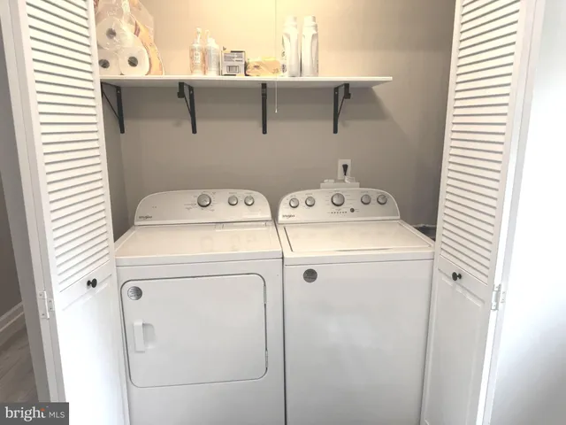 a utility room with dryer and washer