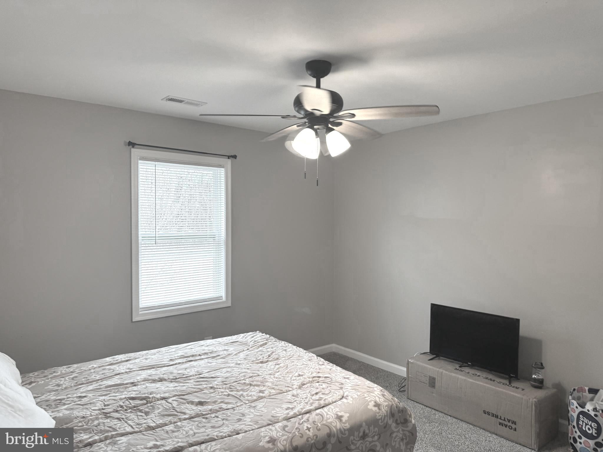 32201 Johnson Road Salisbury, MD 21804 - Photo 22 of 50 a bedroom with a bed and a window