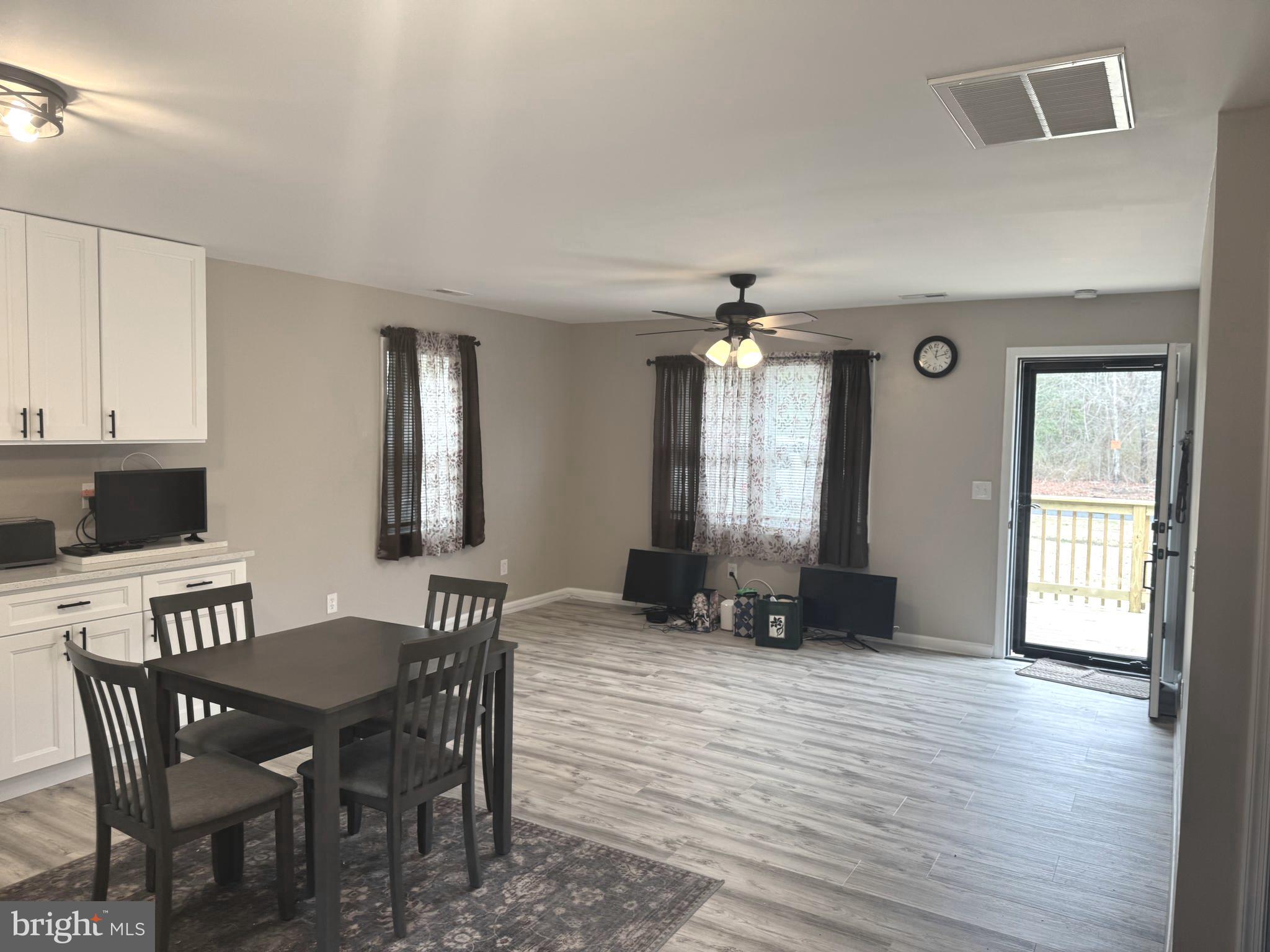 32201 Johnson Road Salisbury, MD 21804 - Photo 34 of 50 a view of a dining room with furniture and wooden floor
