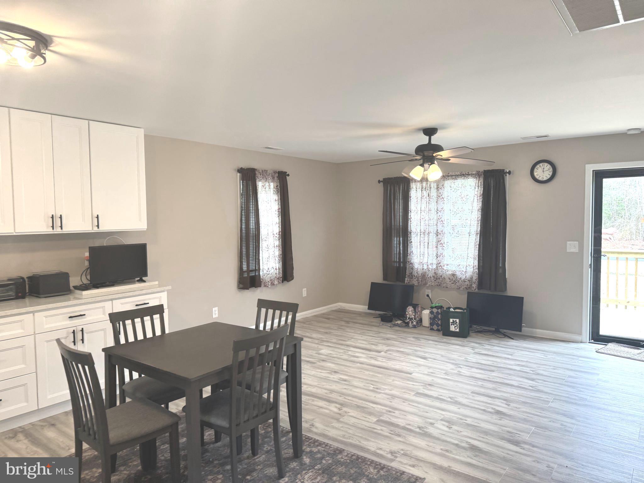 32201 Johnson Road Salisbury, MD 21804 - Photo 6 of 50 a view of a a dining room with furniture window and wooden floor