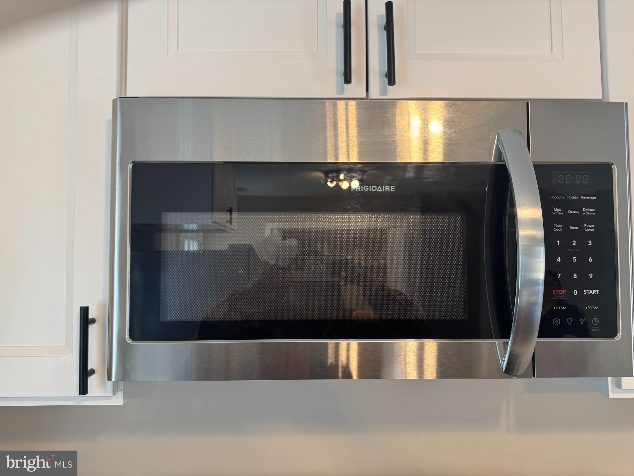 32201 Johnson Road Salisbury, MD 21804 - Photo 9 of 50 a view of kitchen and empty room with wooden floor