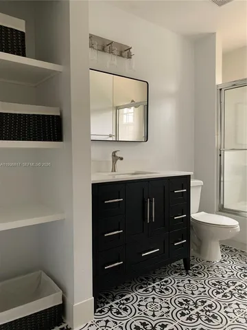 a view of a bathroom with a bathtub and window