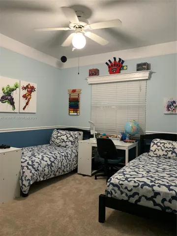 a bedroom with a bed and a chair