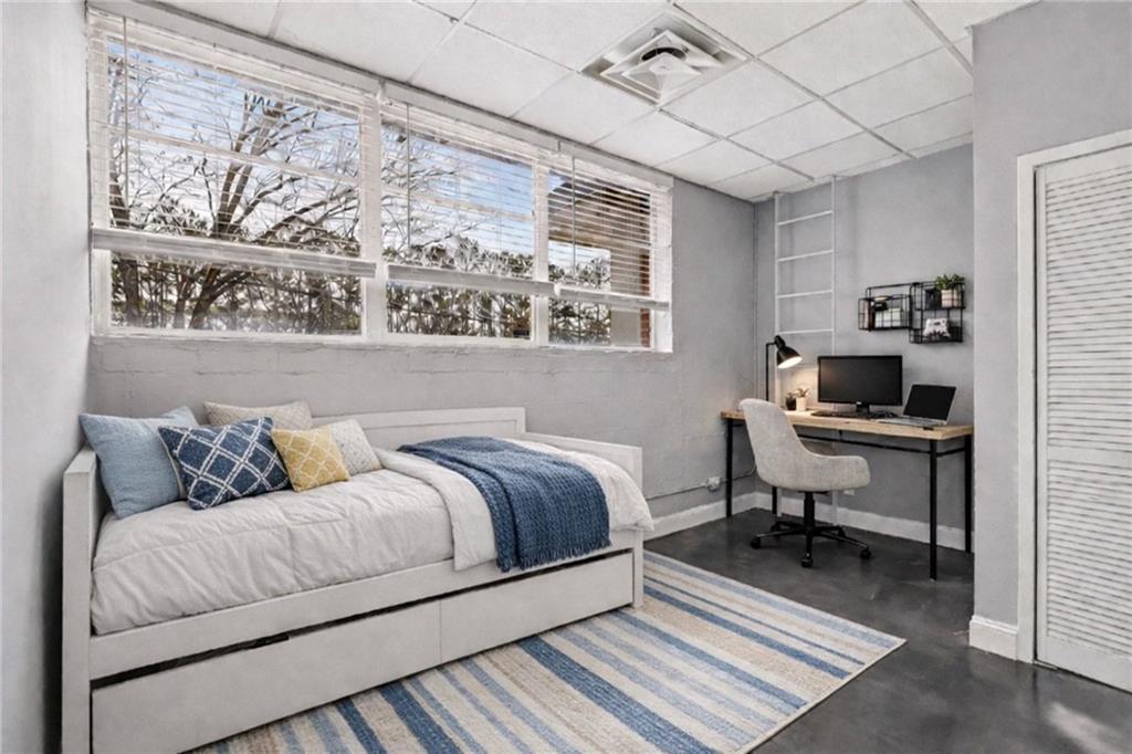 5200 Peachtree Road, Unit 2101 Atlanta, GA 30341 - Photo 20 of 37 a living room with a couch and a window