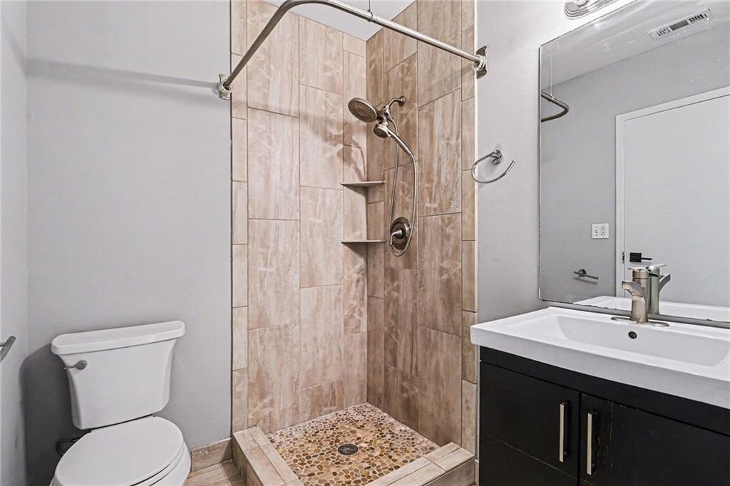 5200 Peachtree Road, Unit 2101 Atlanta, GA 30341 - Photo 23 of 37 a bathroom with a sink toilet and shower