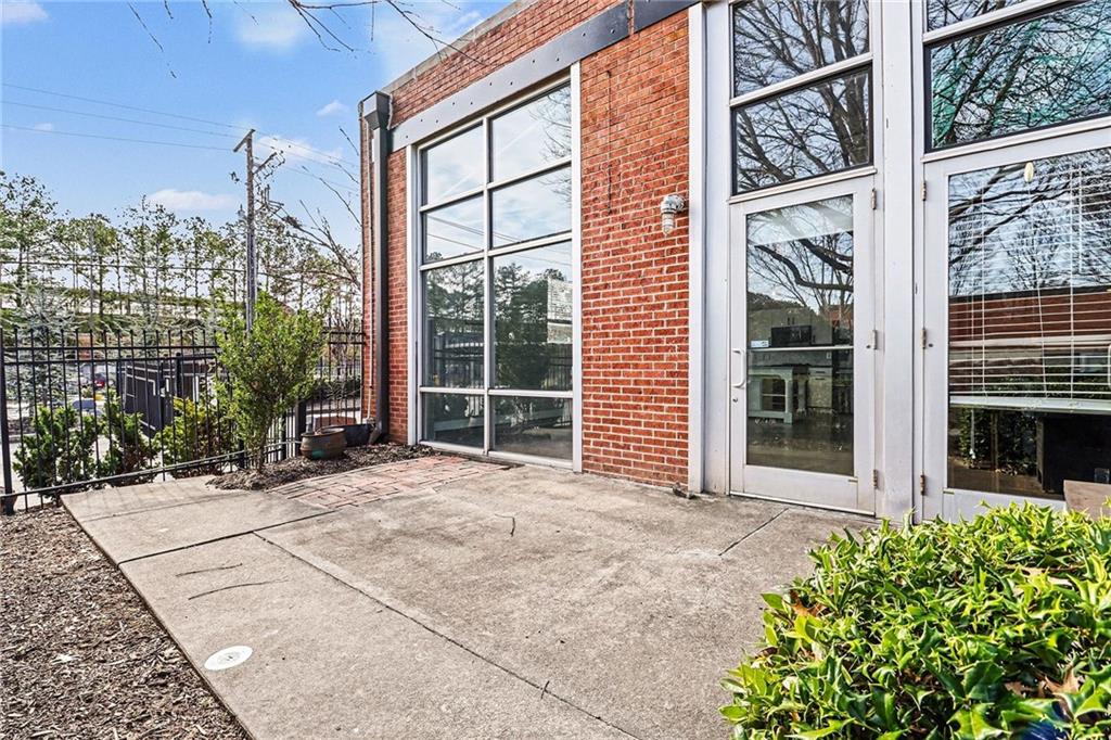 5200 Peachtree Road, Unit 2101 Atlanta, GA 30341 - Photo 26 of 37 a view of a house with a large window and wooden fence