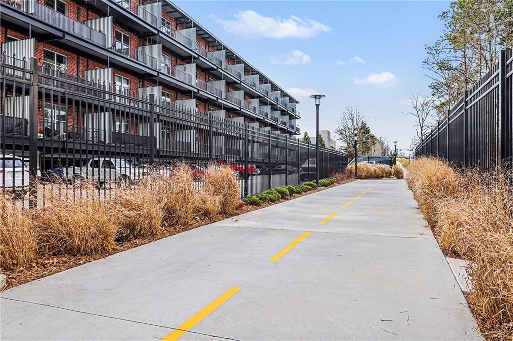 5200 Peachtree Road, Unit 2101 Atlanta, GA 30341 - Photo 30 of 37 a view of swimming pool with outdoor seating and plants