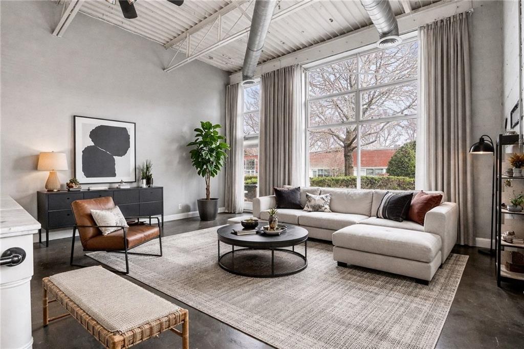 5200 Peachtree Road, Unit 2101 Atlanta, GA 30341 - Photo 6 of 37 a living room with furniture and a large window