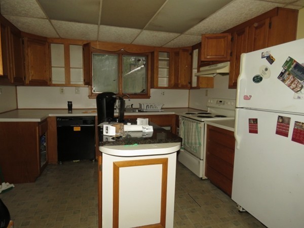 8 East Buckland Road Buckland, MA 01370 - Photo 5 of 10 a kitchen with stainless steel appliances granite countertop a sink stove and refrigerator