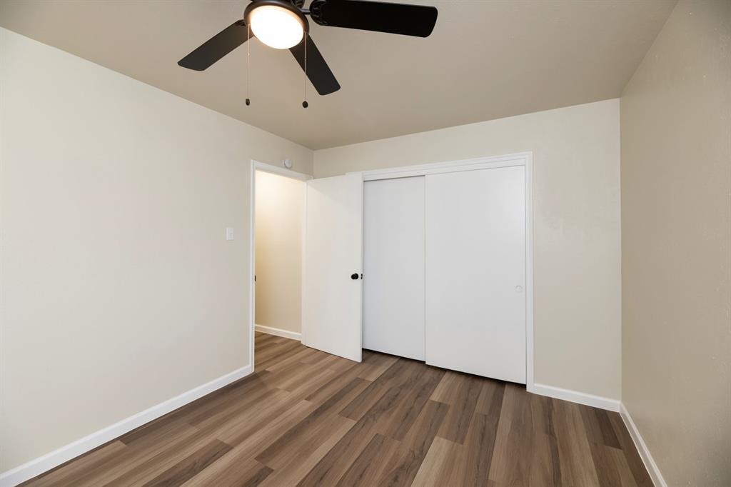 102 Mildred Lane Benbrook, TX 76126 - Photo 14 of 25 wooden floor in an empty room