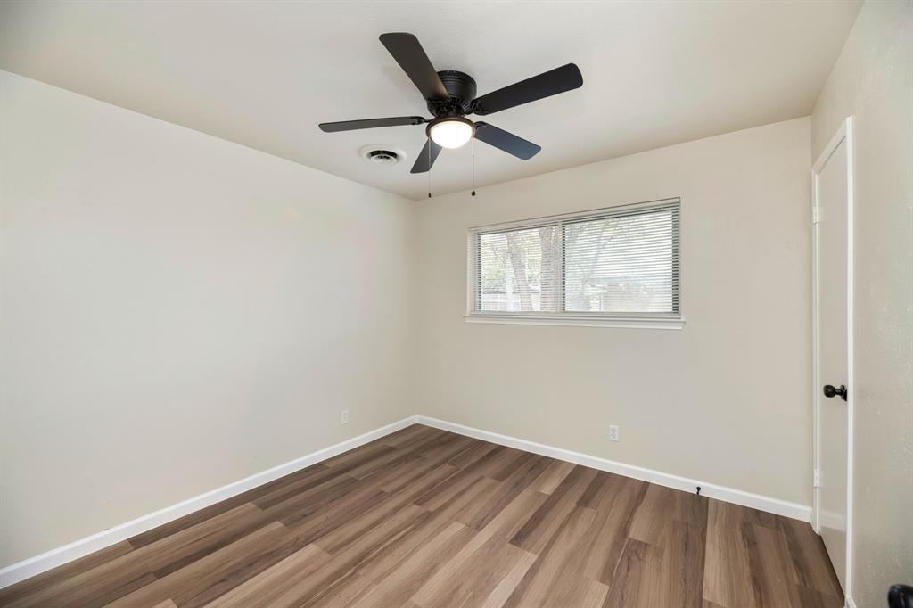 102 Mildred Lane Benbrook, TX 76126 - Photo 15 of 25 a view of empty room with wooden floor