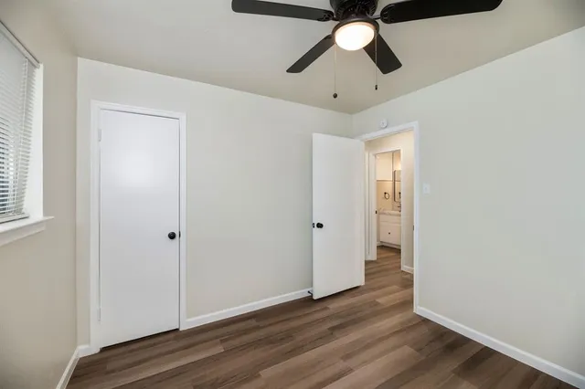 a view of an empty room and wooden floor