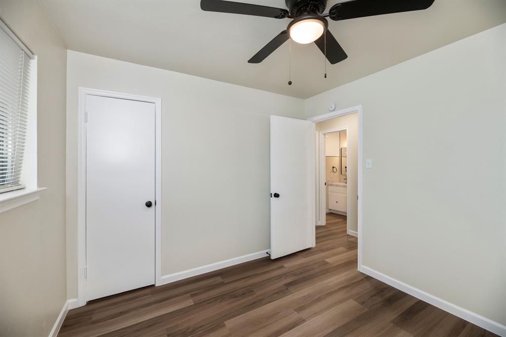 102 Mildred Lane Benbrook, TX 76126 - Photo 16 of 25 a view of an empty room and wooden floor