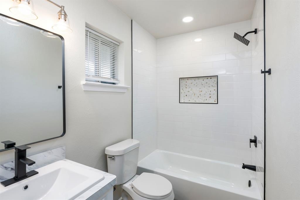 102 Mildred Lane Benbrook, TX 76126 - Photo 20 of 25 a bathroom with a sink toilet and shower