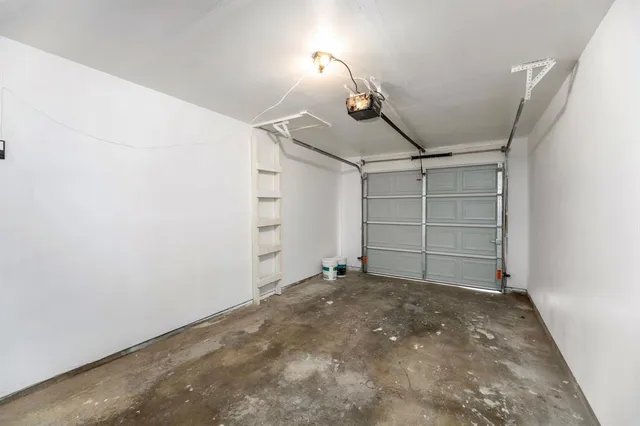 a view of room that has a white walls