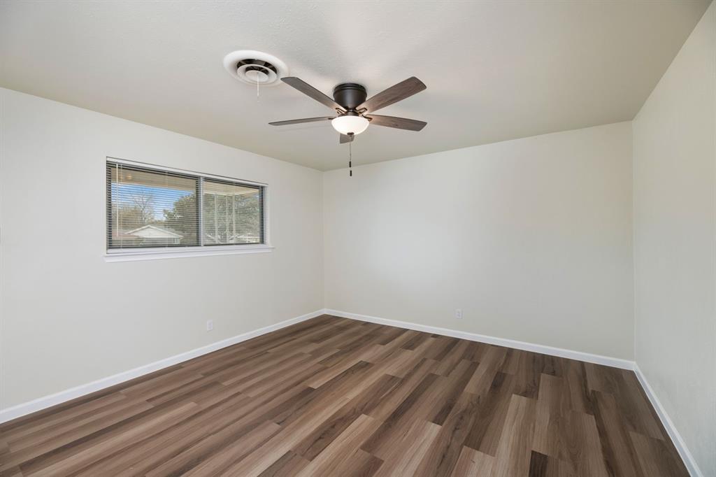 102 Mildred Lane Benbrook, TX 76126 - Photo 6 of 25 a view of room with a ceiling fan