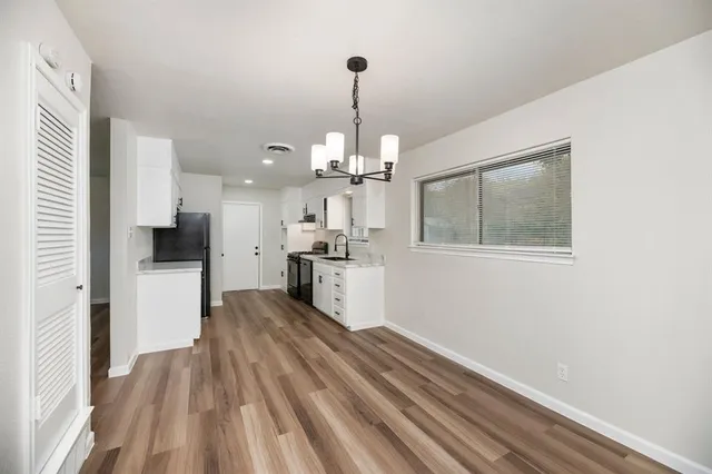 a view of a kitchen from the hallway