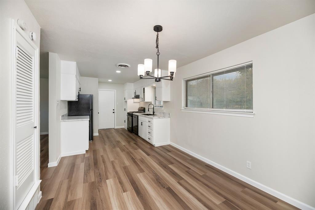 102 Mildred Lane Benbrook, TX 76126 - Photo 9 of 25 a view of a kitchen from the hallway