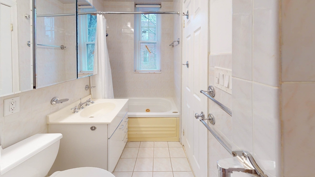 311 Tappan Street, Unit 3 Brookline, MA 02445 - Photo 30 of 35 a bathroom with a sink toilet and shower