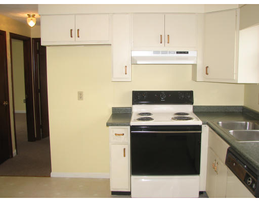 74 Bay Road Revere, MA 02151 - Photo 2 of 5 a kitchen with a stove and a refrigerator