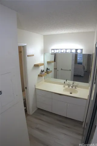 a bathroom with a double vanity sink and mirror