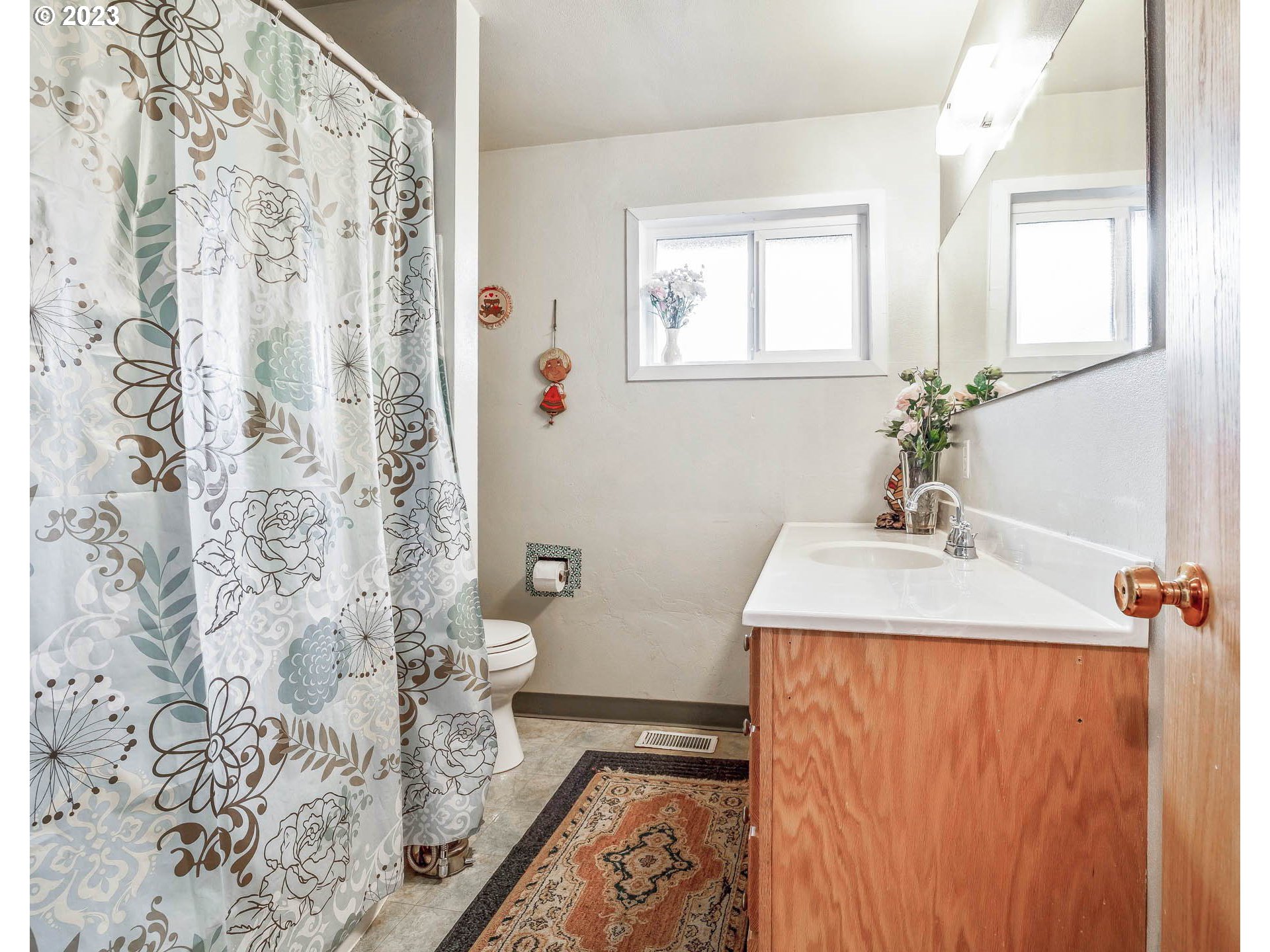 2790 Locust Street Springfield, OR 97477 - Photo 14 of 32 a bathroom with a sink and a mirror