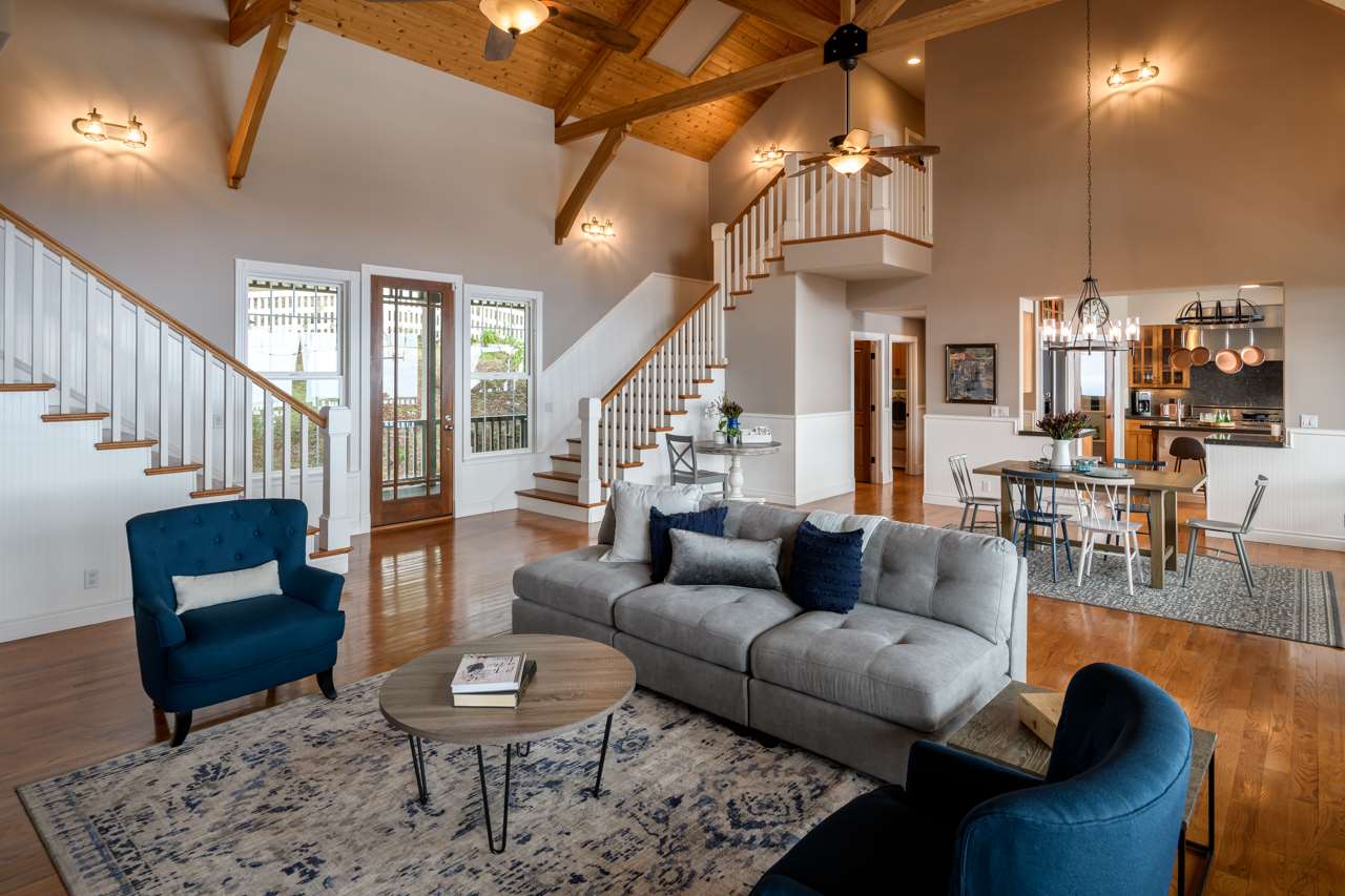 1511 Polipoli Road, Unit A & B Kula, HI 96790 - Photo 17 of 30 a living room with furniture a rug and a chandelier
