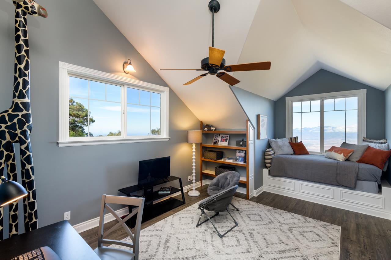 1511 Polipoli Road, Unit A & B Kula, HI 96790 - Photo 23 of 30 a living room with furniture a rug and a window