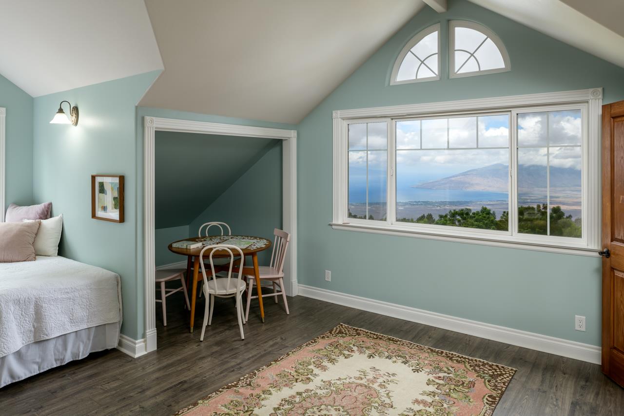 1511 Polipoli Road, Unit A & B Kula, HI 96790 - Photo 28 of 30 a bedroom with a bed and a window