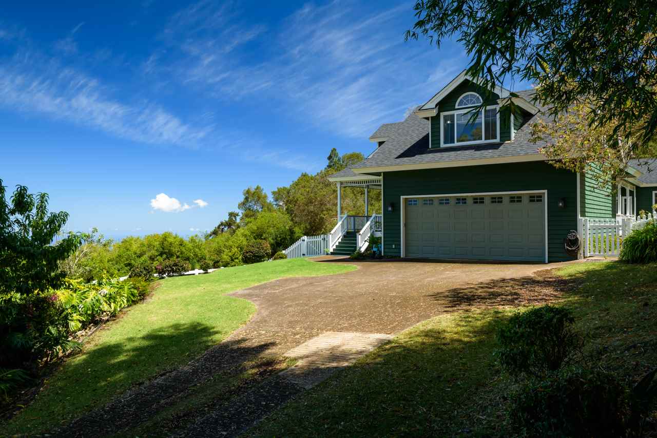 1511 Polipoli Road, Unit A & B Kula, HI 96790 - Photo 6 of 30 a front view of a house with a yard and garage