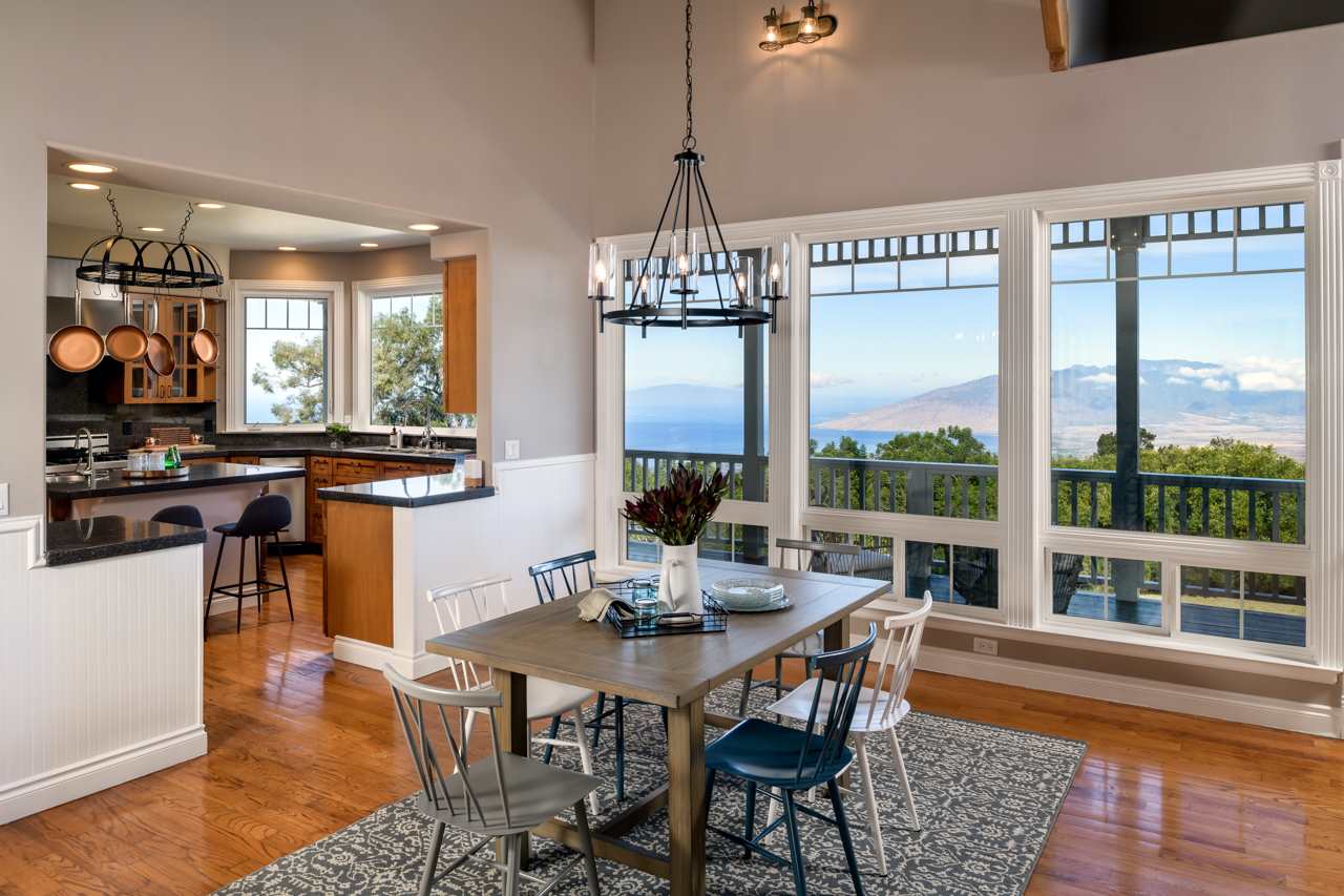 1511 Polipoli Road, Unit A & B Kula, HI 96790 - Photo 9 of 30 a view of a dining room with furniture wooden floor and a chandelier