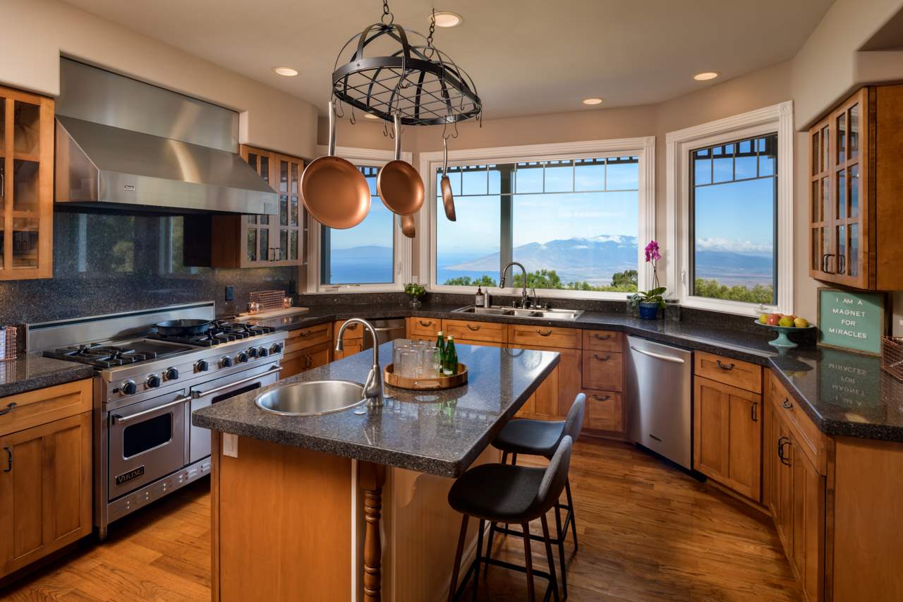 1511 Polipoli Road, Unit A & B Kula, HI 96790 - Photo 10 of 30 a kitchen with stainless steel appliances granite countertop a stove a sink and a microwave