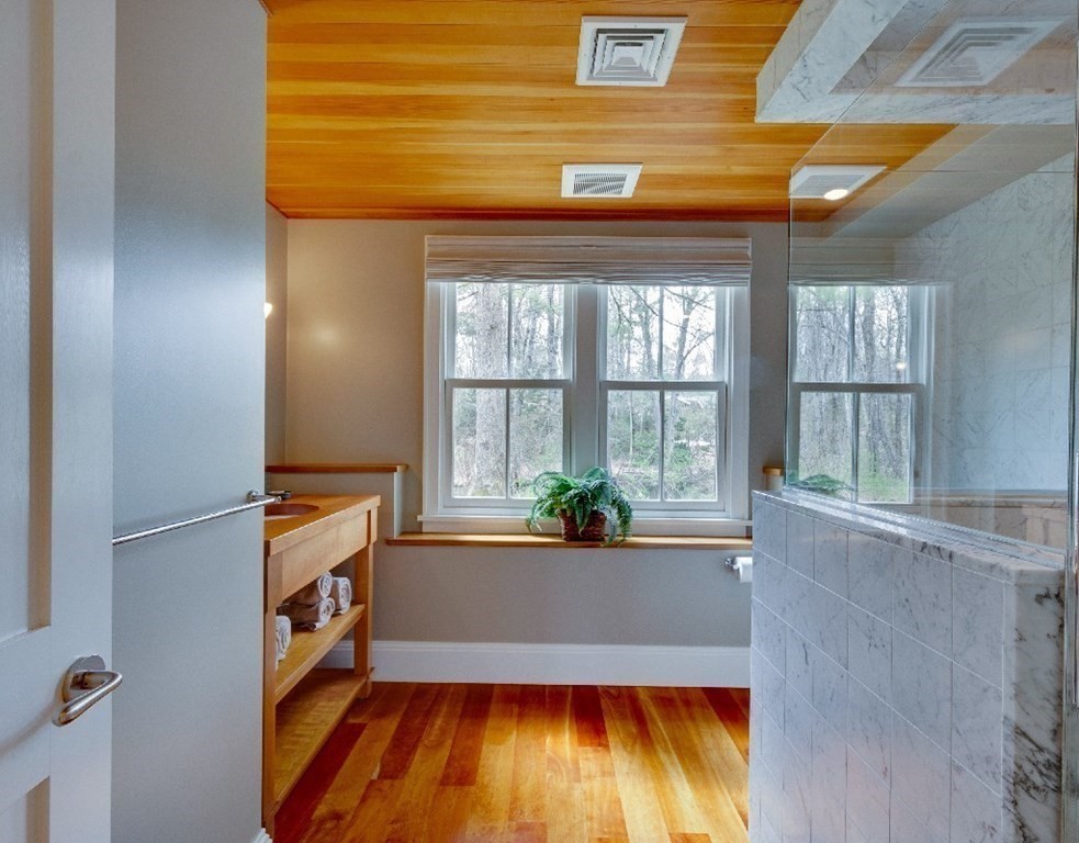 75 Todd Pond Road Lincoln, MA 01773 - Photo 17 of 39 a view of an empty room with a window and wooden floor