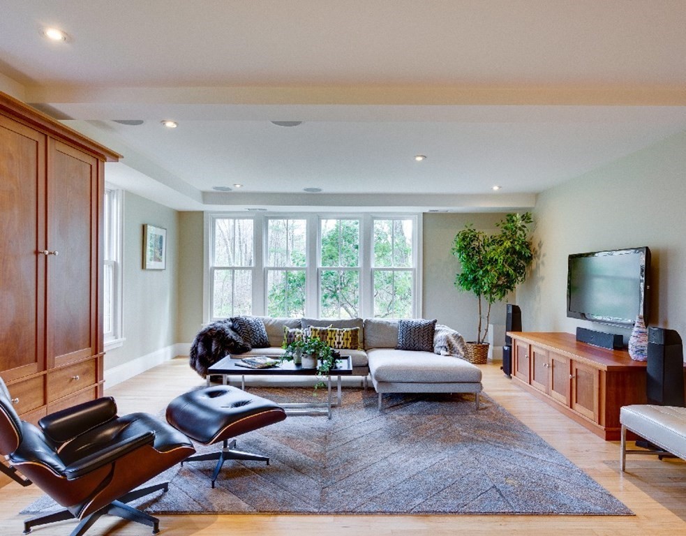 75 Todd Pond Road Lincoln, MA 01773 - Photo 6 of 39 a living room with furniture and a flat screen tv