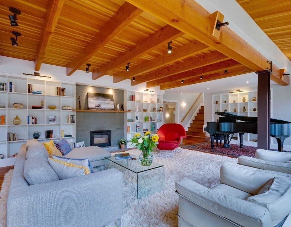 75 Todd Pond Road Lincoln, MA 01773 - Photo 7 of 39 a living room with furniture and a fireplace