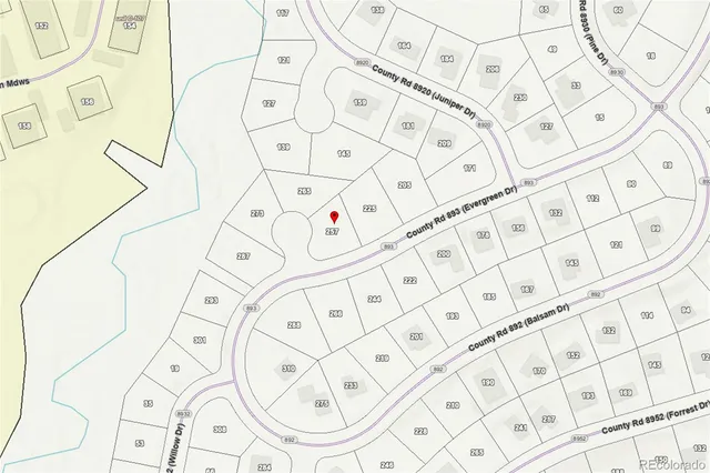 a view of houses with a yard