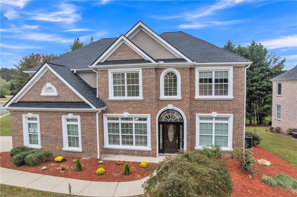 3148 Wolf Club Drive Southwest Atlanta, GA 30349 - Photo 1 of 1 front view of a house with a yard
