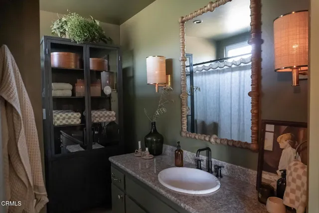 a bathroom with a sink double vanity and a mirror