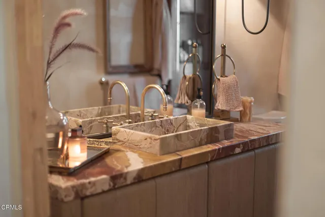 a bathroom with a sink and mirror